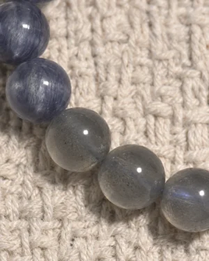 Close-up of blue kyanite and smoky grey moonstone beads in the Dusk Meridian bracelet