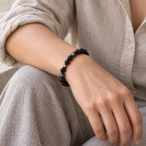 Silver Nocturne obsidian and sterling silver bracelet worn with a neutral linen shirt